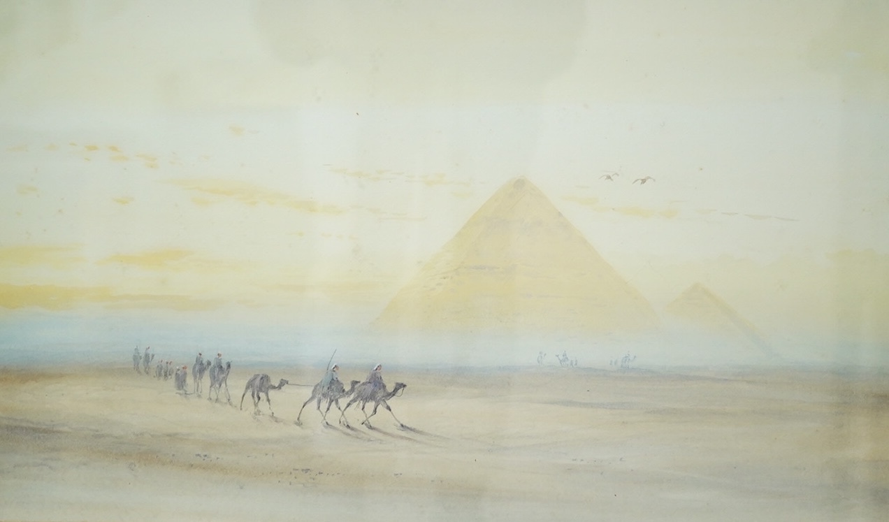 Orientalist school, pair of watercolours, Egyptian scenes with camels before pyramids, unsigned, 29 x 50cm. Condition - fair